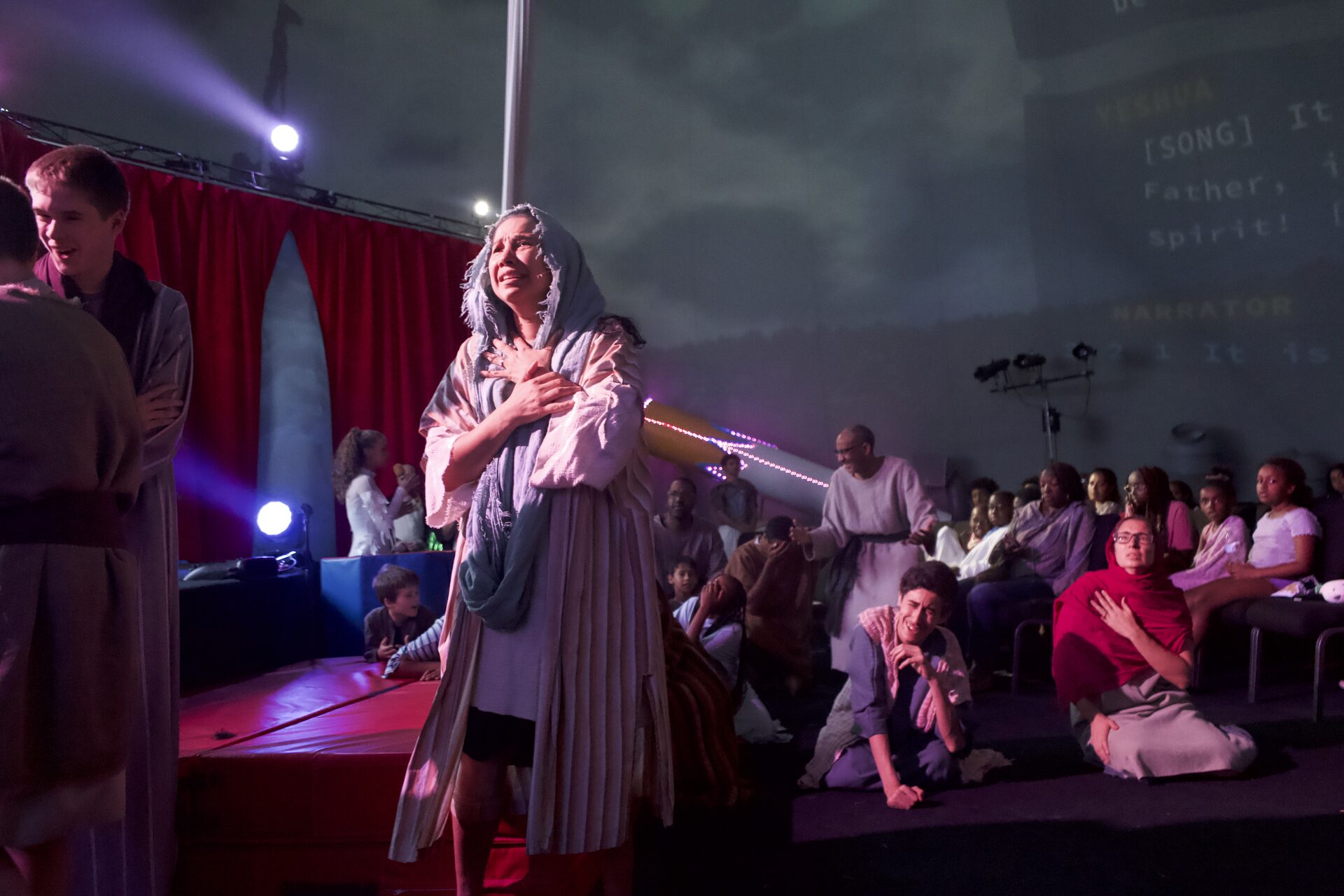A cast member in a powerful moment during The Greatest Show of All